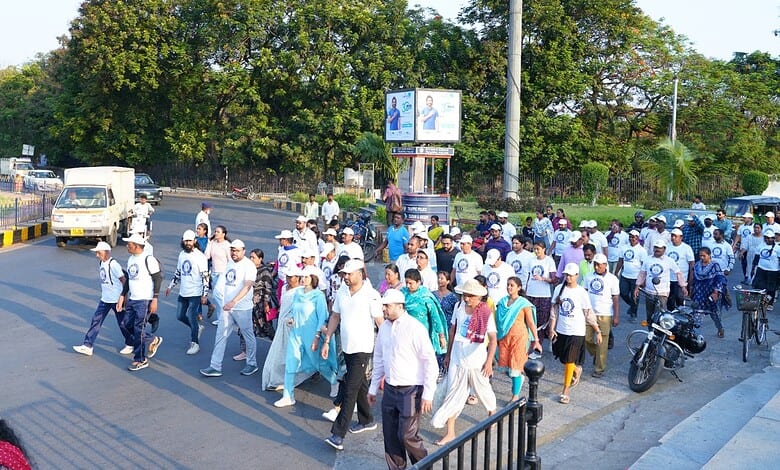 Census 2026 awareness walkathon at Necklace Road in Hyderabad with participants marching for demographic.