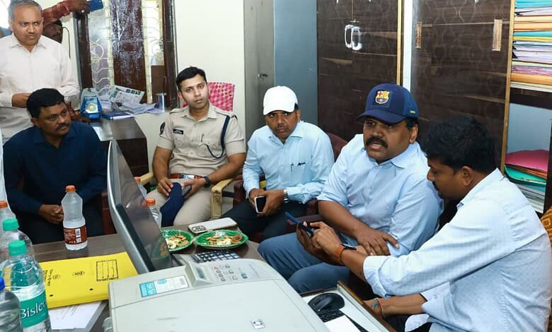 Officials discuss paddy transportation improvements at Nalgonda rice mill.