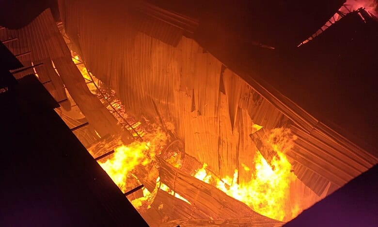 Massive fire at Bahadurpura scrap yard near Hyderabad zoo with intense flames and smoke.