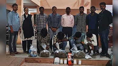 Police display seized ganja and arrests in Hyderabad drug bust operation.