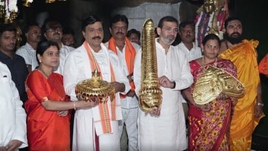 Gold-plated copper ornaments donated to Anjanadri temple, displayed during a ceremonial event.