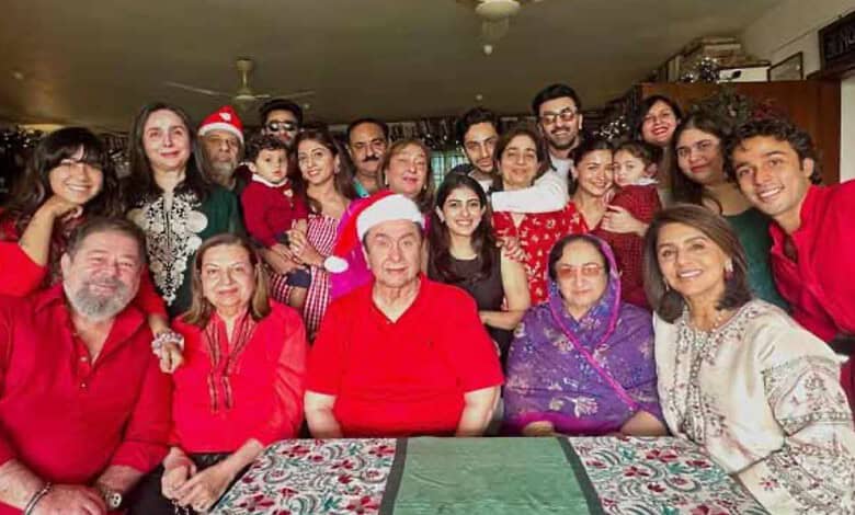 Celebration of Christmas with a diverse group of people, including children and seniors, in a festive ind.