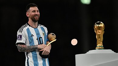 Argentina football team celebrating with trophy, Messi holding Ballon d'Or, during FIFA World Cup 2026.