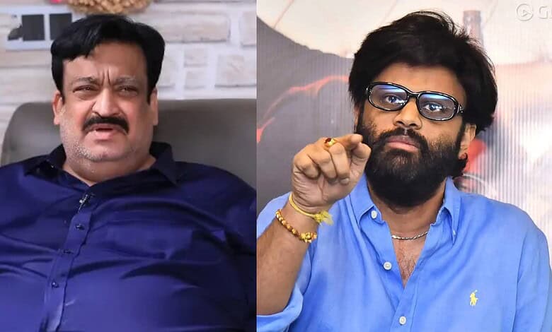 Two Indian men in casual attire, one with glasses and beard, the other with mustache, seated indoors.