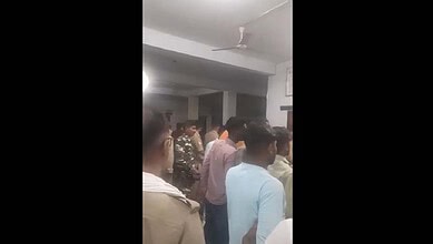 Crowd gathered at the scene of a fatal accident involving a speeding car and a bike in Uttar Pradesh.