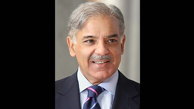 Pakistan government official speaking at a press conference about austerity measures amid US-Iran deadloc.
