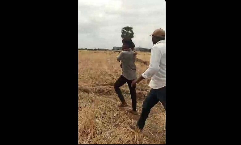 villagers take boy to safety after he was rescued from the borewell in Nalgonda