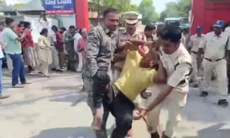 Protest scene with TGSRTC workers and police officers during demonstration about faulty breath analyser m.