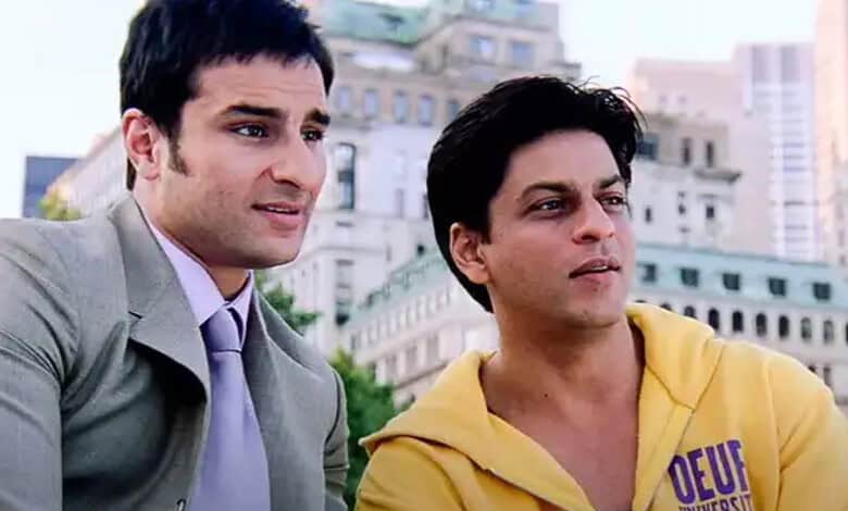 Young men sitting outdoors in an urban setting, engaging in conversation, with city buildings in the back.