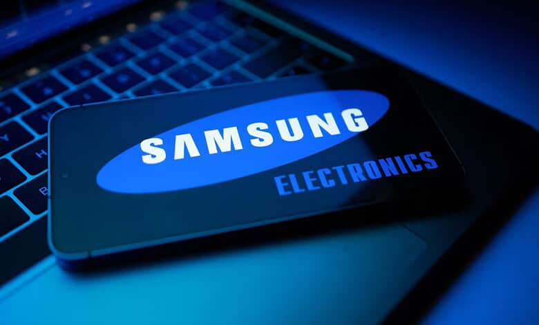 Samsung electronics smartphone on keyboard, highlighting AI-driven growth and chip demand.