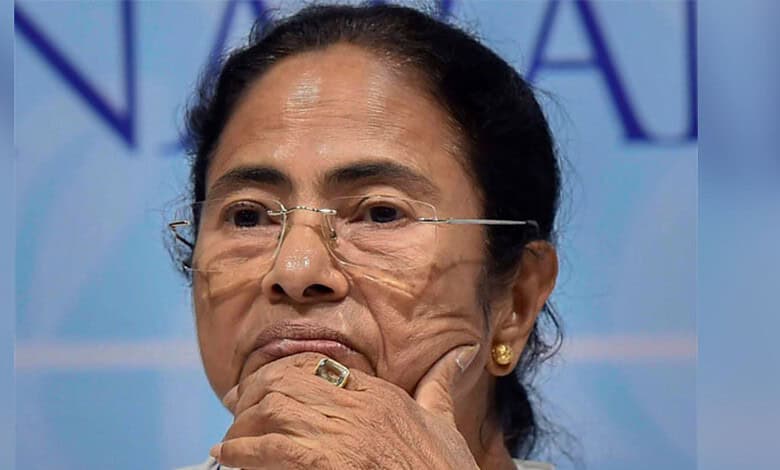 An image of Mamata Banerjee with a serious expression, highlighting political tensions during the assembl.