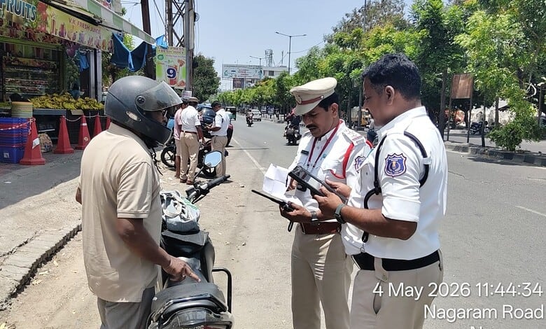 Malkajgiri Traffic police inspect the documents of a person's vehicle