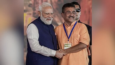 Suvendu Adhikari taking oath as West Bengal's first BJP Chief Minister during a formal political event.