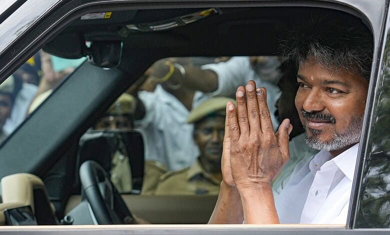 Celebration of Tamil Nadu election victory with Vijay, the new Chief Minister, and supporters in a car.