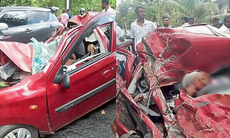 A woman and a child injured in a severe car accident with a heavily damaged red vehicle. Bystanders gathe.
