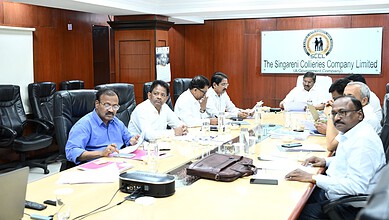 Business meeting at Singareni Collieries Company Limited conference room in India.