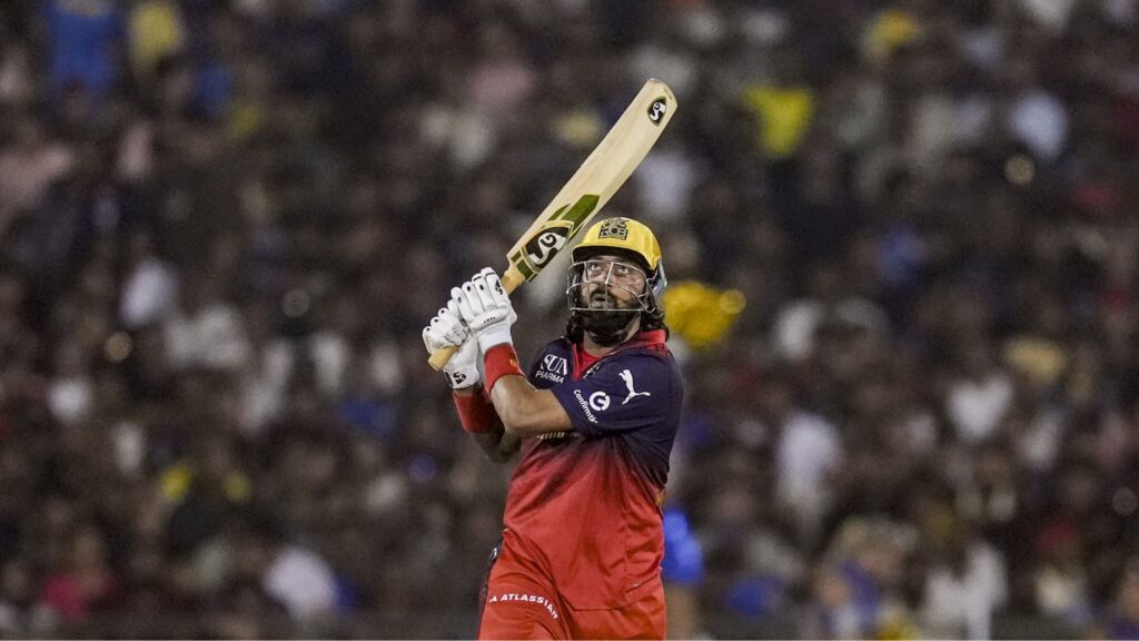 RCB cricket player celebrating after winning IPL match against MI with last-ball finish.