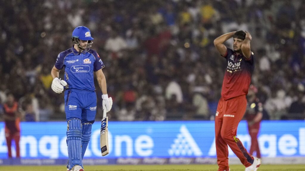 RCB cricket player and MI player during last-ball IPL match thriller, intense moment, sports action, Indi.