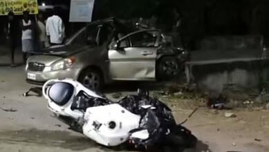 A bike and car in mangled condition after accident in Mahabubnagar