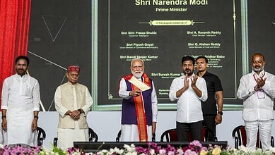 Modi at an official event, with political leaders, during a government function in India.