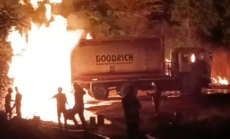 Tanker on fire in Sangareddy after chemical accident, emergency responders at the scene.