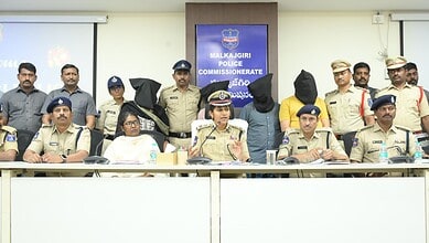 Police officials and officers at a press conference in Malkajgiri, Hyderabad, India.
