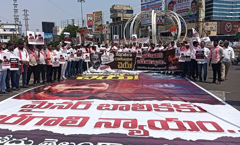 Protest march in Hyderabad demanding justice and rights, with participants holding banners and placards i.