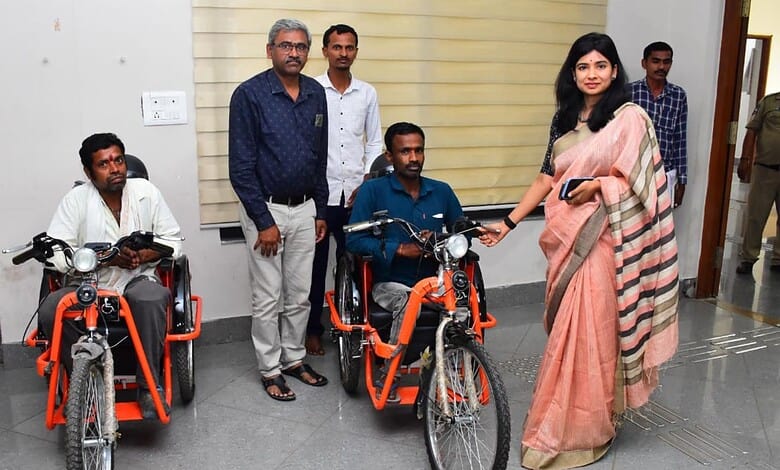 Accessible transportation initiative with individuals using adaptive bikes and supportive staff.