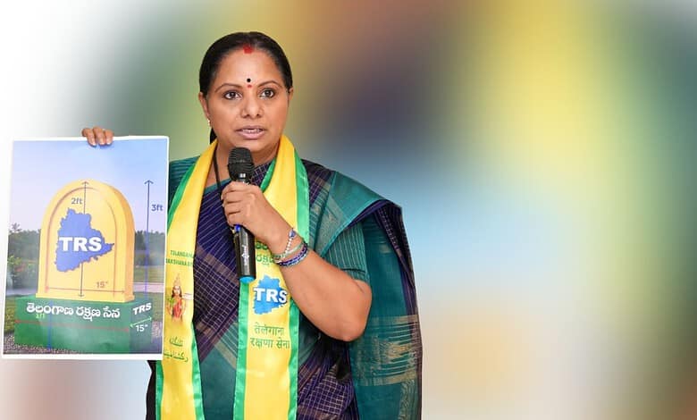 Empowered woman politician holding a TRS poster during a public event in Telangana, India.