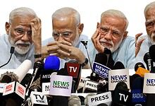 Indian Prime Minister Narendra Modi addressing the media with multiple microphones and news channels at a.