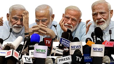 Indian Prime Minister Narendra Modi addressing the media with multiple microphones and news channels at a.