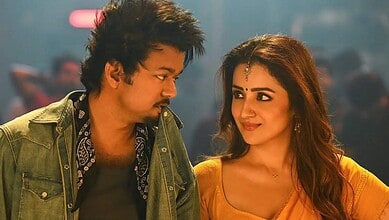 A vibrant scene from a Tamil movie featuring Thalapathy Vijay and Trisha in a romantic moment.