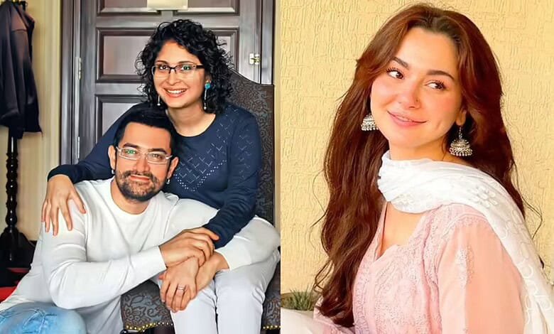 Hania Aamir smiling with a man, both dressed casually, in a cozy indoor setting.