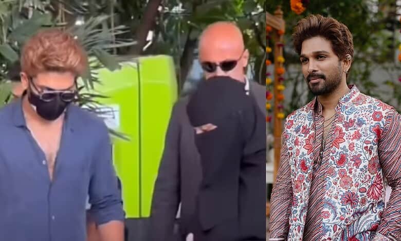 Allu Arjun shows a kind gesture towards a woman in a burqa, capturing a heartfelt moment outdoors.