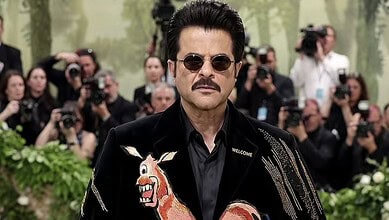 Anil Kapoor attending the Met Gala 2026 in a stylish black outfit with embroidered details, surrounded by.