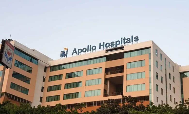 Modern Apollo Hospitals building with clear signage and contemporary architecture in an urban setting.