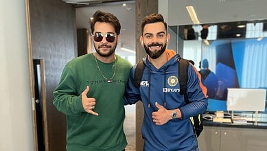 Asim Azhar and Virat Kohli smiling together at an airport, showcasing celebrity interaction and sports en.