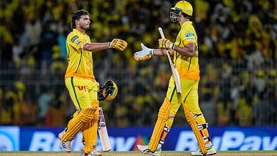 Urvil celebrates with CSK teammates after a five-wicket victory over LSG in cricket match.