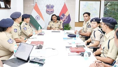 Telangana police officers in a meeting discussing road safety initiatives.