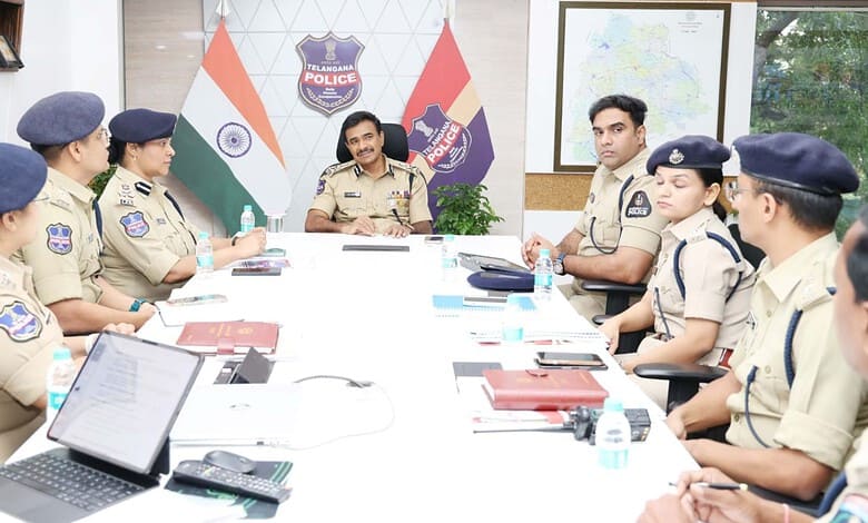 Telangana police officers in a meeting discussing road safety initiatives.