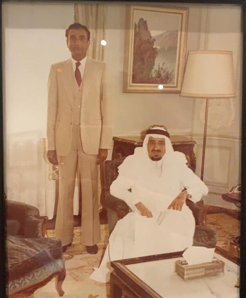 Dr Mohammad Iqbal Sanai standing beside King Khaled bin Abdulaziz in Saudi Arabia.