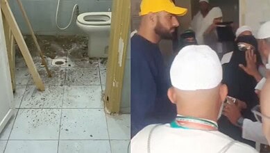 Dirty washroom with wastewater on floor as Haj pilgrims gather to complain.