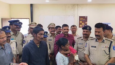 A young girl is being comforted by police officers and officials after a successful rescue of a six-month.