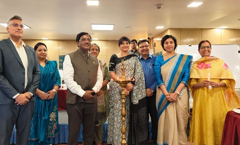 Group of officials and women at a formal event promoting nursing employment opportunities in Germany.