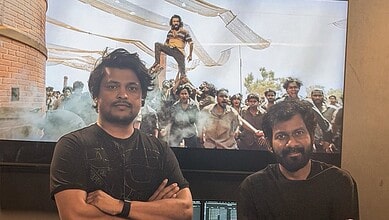 Ram Charan and team at 'Peddi' film event with fans and media.