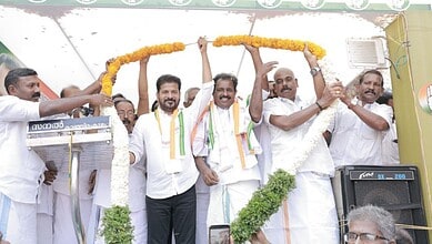 Celebrating Kerala UDF's win with leaders, including Revanth Reddy, at a campaign event.