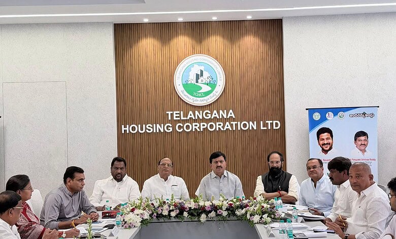 Officials at Telangana Housing Corporation LTD discuss land dispute resolutions.
