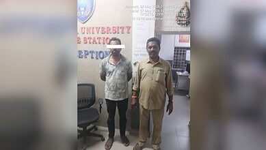 A man with a blurred face standing next to a smiling man in an office setting at The Siasat Daily.