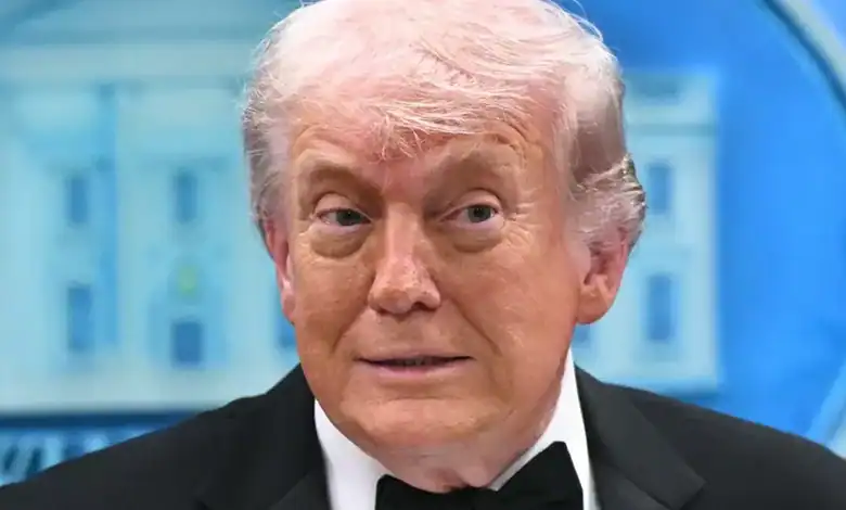 Donald Trump at a press event, delivering a speech in a professional environment.