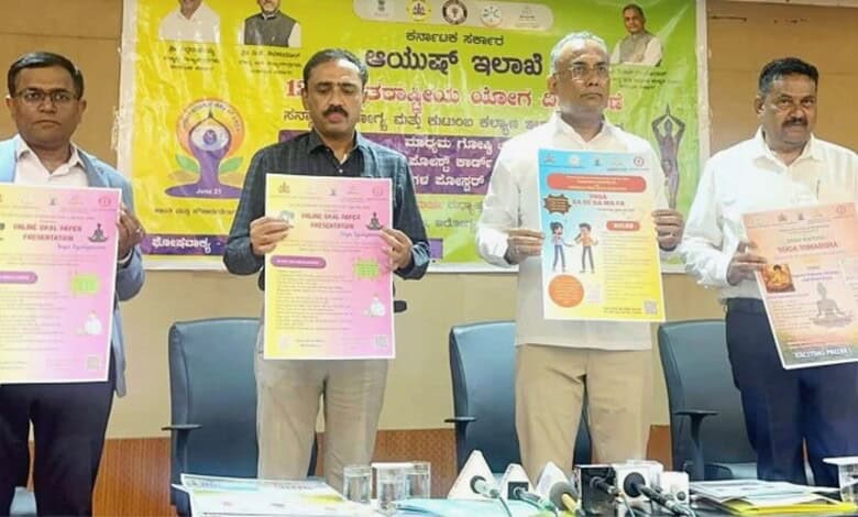 Community health awareness event with officials displaying health posters and promoting wellness initiati.